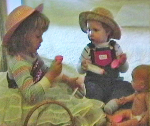 Siblings getting along at a tea party